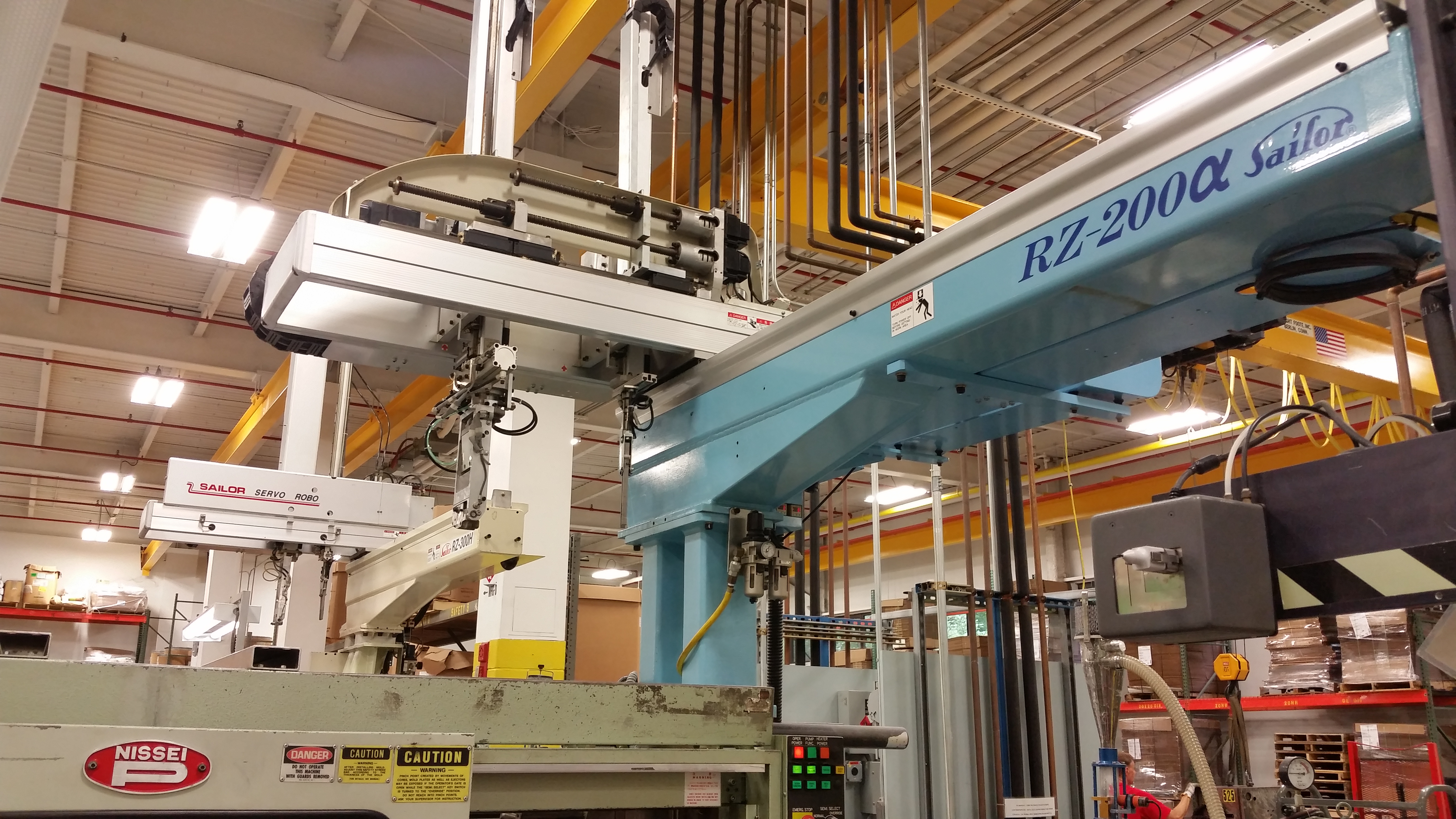 Industrial machine system with robotic transfer axis and automation framework